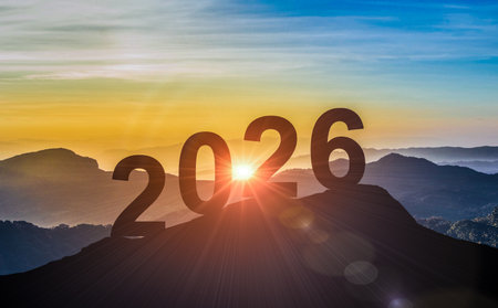 The year 2026 on top of mountain with beautiful sunrise. Represents new opportunities, fresh starts, and positive future ahead nowの写真素材