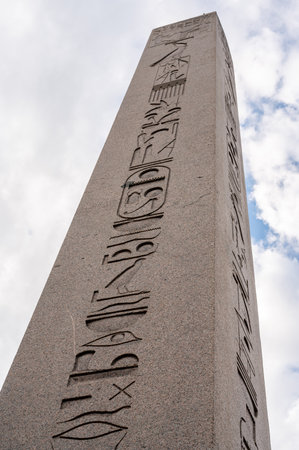 Low angle close-up of Obelisk of Theodosius in Sultanahmet Square. Ancient Egyptian hieroglyphs on pink granite. History conceptの写真素材