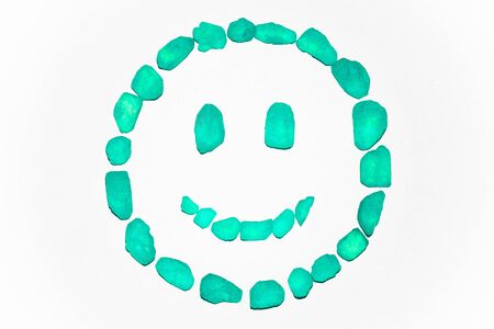 Green smiley face on a white backgroundの写真素材