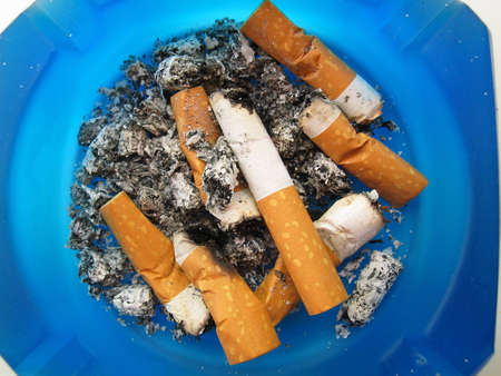 Ashtray overflown by old stubs
