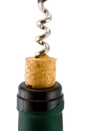 Corkscrew inserted into a wine fuse in a bottleの写真素材