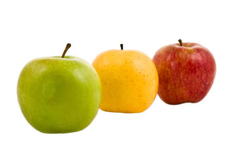 Three fresh apples of different colors on a white backgroundの写真素材