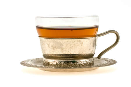 Transparent cup of tea on  a dishの写真素材