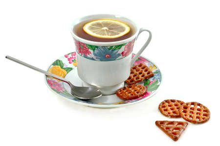 tea with lemon and biscuits on a white backgroundの写真素材