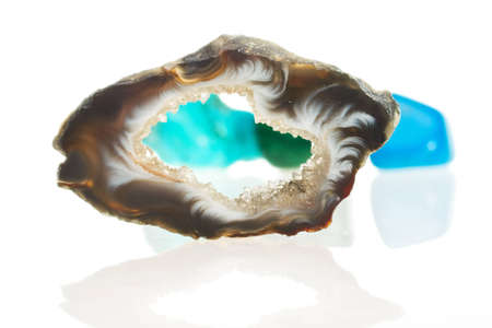 Ornamental stone of turquoise color on a white backgroundの写真素材