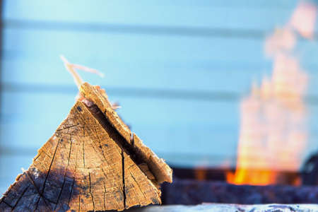 log of wood in the background of fireの写真素材
