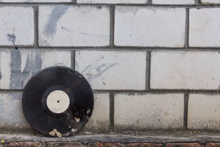 vinyl record on a background of a brick wallの写真素材