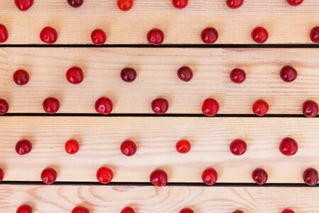 Fresh cherries on a wooden backgroundの写真素材