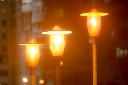 Street lighting. Streetlamp shines in the darkness.の写真素材