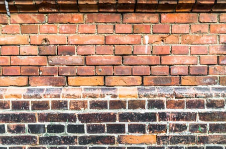 Brick wall of red orange color background. Vintage old masonry.の写真素材