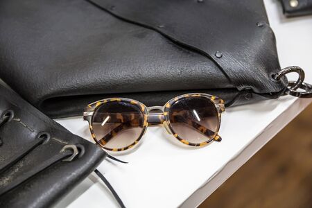 fashion accessories and leather bracelets on the shelfの写真素材