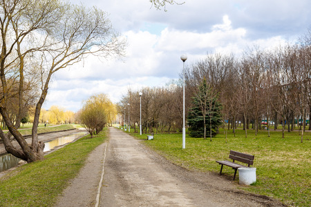 Park in the center of the city in early spring in sunny clear weather