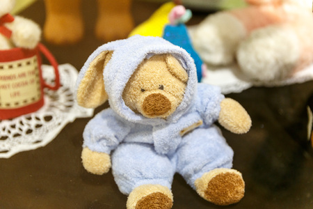 Beautiful teddy bears from around the world stand on the shelf in a toy storeの写真素材