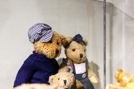 Beautiful teddy bears from around the world stand on the shelf in a toy storeの写真素材