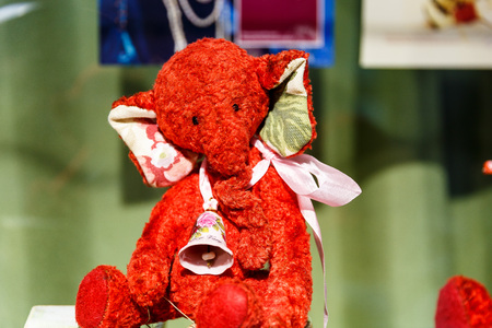 Beautiful teddy bears from around the world stand on the shelf in a toy storeの写真素材