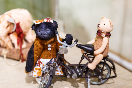 Beautiful teddy bears from around the world stand on the shelf in a toy storeの写真素材