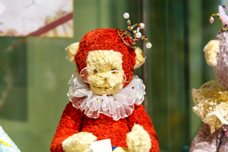 Beautiful teddy bears from around the world stand on the shelf in a toy storeの写真素材