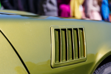 Side part of a classic or retro car in a car shop