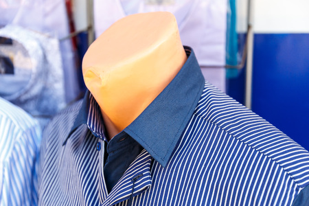 Men's shirts in the package hang in the clothing storeの写真素材