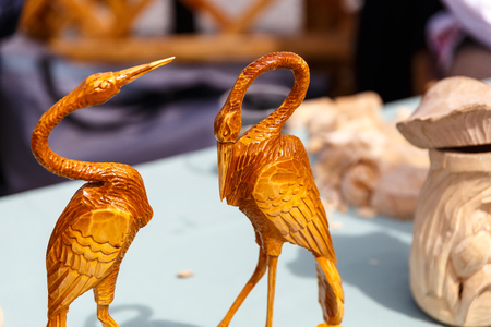 Dolls toys tableware clothes handmade souvenirs at the exhibition of folk artsの写真素材