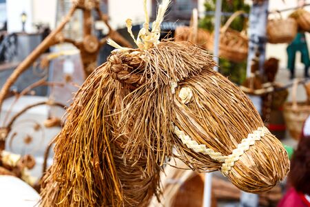 Handmade dolls made from straw at an exhibition of folk artsの写真素材