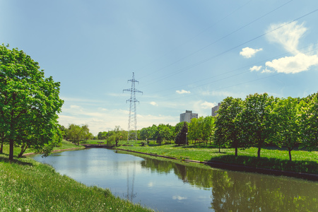 Green park with a lake in the center of the city I have a clear sunny summer weatherの写真素材