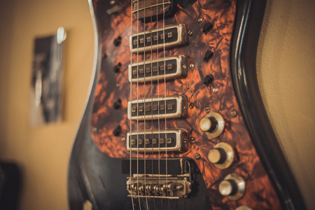 Retro bass guitar in vintage style on shelves in a musical instrument storeの写真素材