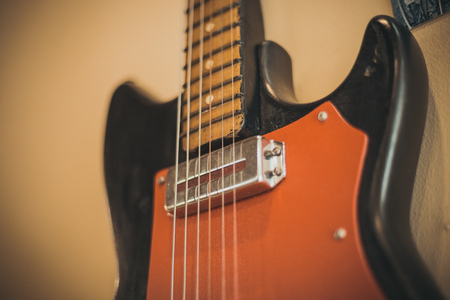 Retro bass guitar in vintage style on shelves in a musical instrument storeの写真素材