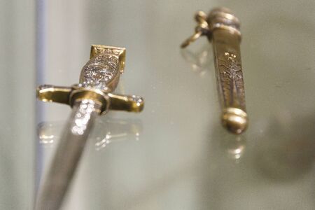 daggers knives saber swords lie on the surface in a private collectionの写真素材