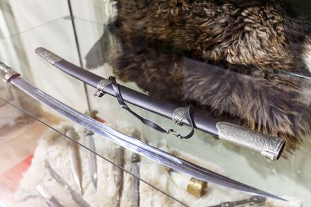 daggers knives saber swords lie on the surface in a private collectionの写真素材