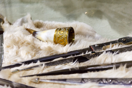 daggers knives saber swords lie on the surface in a private collectionの写真素材