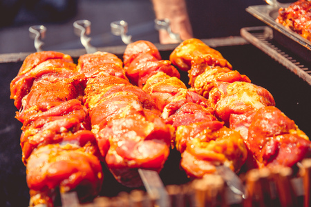 A barbecue is fried on an open air charcoal grill