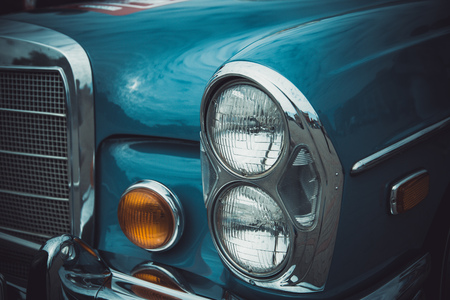 Headlights and body of an old classic car at an exhibition of vintage carsのeditorial素材