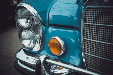 Headlights and body of an old classic car at an exhibition of vintage carsのeditorial素材