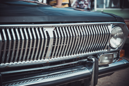 Headlights and body of an old classic car at an exhibition of vintage carsのeditorial素材