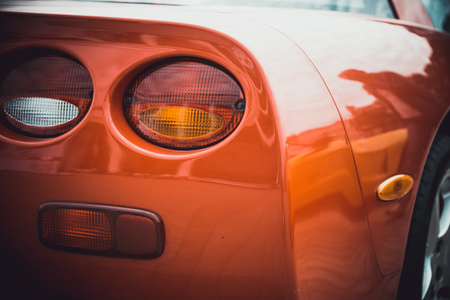 Headlights and body of an old classic car at an exhibition of vintage carsの写真素材