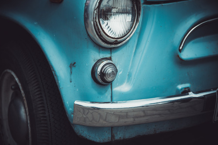 Headlights and body of an old classic car at an exhibition of vintage carsの写真素材