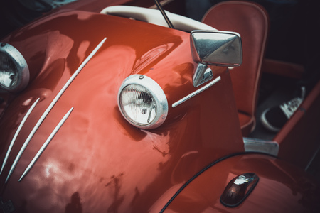 Headlights and body of an old classic car at an exhibition of vintage carsの写真素材