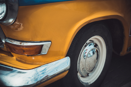 Headlights and body of an old classic car at an exhibition of vintage carsの写真素材