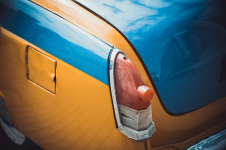 Headlights and body of an old classic car at an exhibition of vintage carsの写真素材