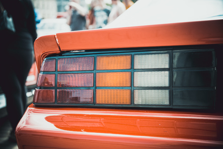 Headlights and body of an old classic car at an exhibition of vintage carsの写真素材
