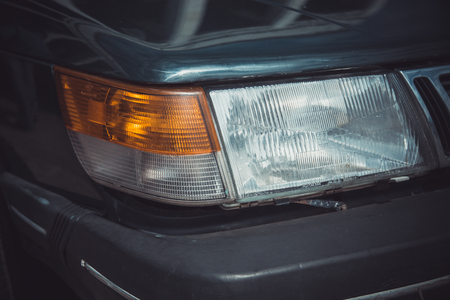 Headlights and body of an old classic car at an exhibition of vintage carsの写真素材