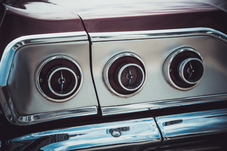 Headlights and body of an old classic car at an exhibition of vintage carsの写真素材