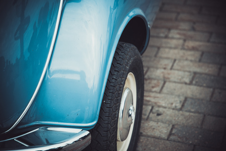 Wheel of an old classic retro car at an exhibition of vintage carsの写真素材