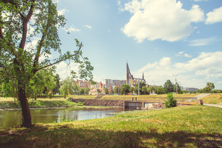 Park with a lake in the center of the city in a hot, sunny summer weatherの写真素材