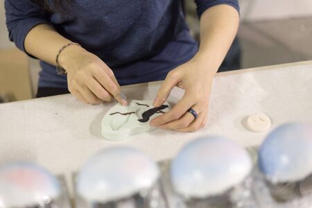 woman handicrafts New Year and Christmas tree toys for the Christmas treeの写真素材