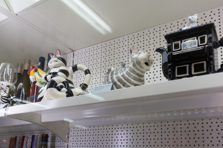 MINSK, BELARUS - OCTOBER 10, 2017: SOUVENIRS IN THE FORM OF CATS ARE SOLD ON SHELVES IN THE STORE OF GIFTSのeditorial素材