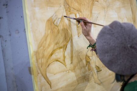 girl artist draw with coffee and chocolate pictureの写真素材