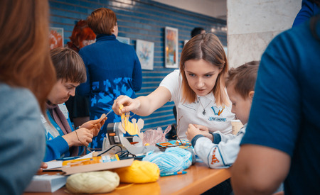MINSK, BELARUS - MAY 1, 2017: cute kid with down's syndrome playing in kindergartenのeditorial素材