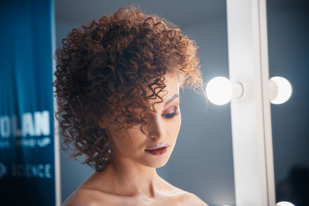 MINSK, BELARUS - MAY 1, 2017: Confident young woman preening in dressing roomのeditorial素材